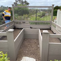 A-Group Handyman - Painting a redwood garden with non-toxic materials