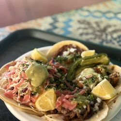 Assortment of tacos loaded with toppings