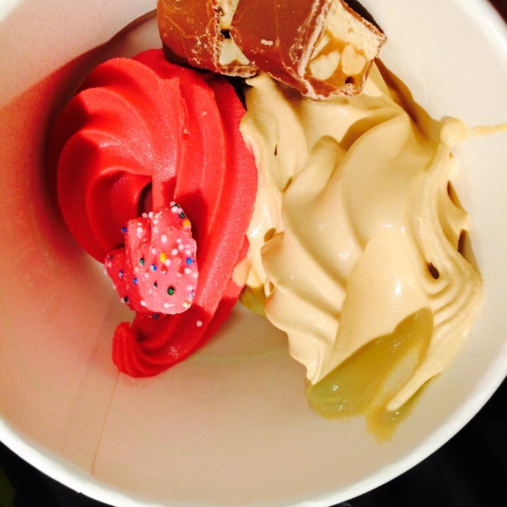 Yo Yo Berri - Pomegranate Sorbet, creme brûlée, a frosted animal cracker, and snicker pieces. - Ice Cream & Frozen Yogurt Near Me - Omaha, Nebraska Yo Yo Berri - Pomegranate Sorbet, creme brûlée, a frosted animal cracker, and snicker pieces. - Ice Cream & Frozen Yogurt Near Me - Omaha, Nebraska