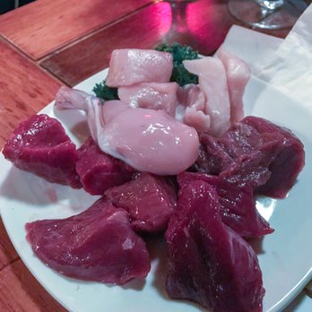 Grizzly House - Exotic platter: Shark, Alligator, Kangaroo, Ostrich, Frogs Legs, Buffalo and Venison. - Fondue Near Me - Banff, Alberta Grizzly House - Exotic platter: Shark, Alligator, Kangaroo, Ostrich, Frogs Legs, Buffalo and Venison. - Fondue Near Me - Banff, Alberta