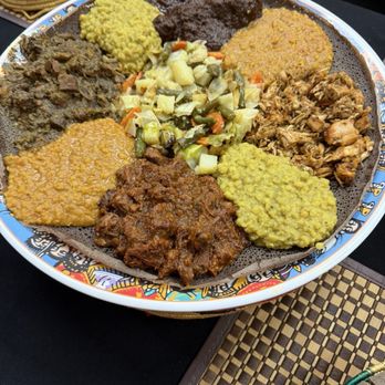 Uchenna - Combo plate with mixed meats and vegetable dishes. - Ethiopian Near Me - Colorado Springs, Colorado