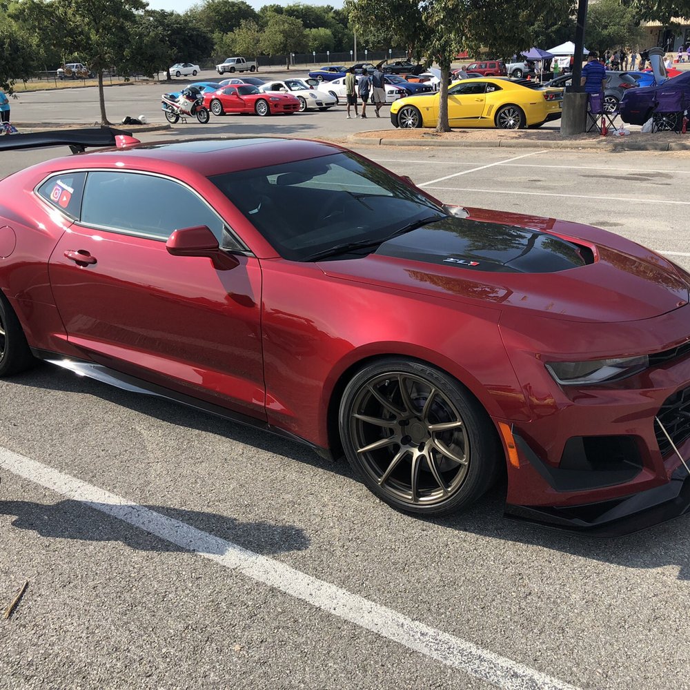 Austin’s - My daughter walking next to a customized Camaro - Bowling Near Me - Pflugerville, Texas