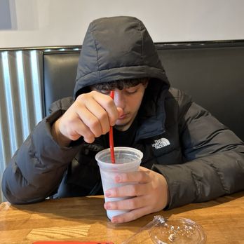 Bomb Burger - My cool nephew enjoying his  Milkshake - Cookies & Cream - Chicken Wings Near Me - Bergenfield, New Jersey
