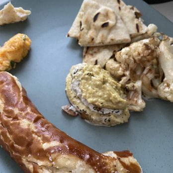 Roost - Persian eggplant dip is $10, bread service is $8, and the famous fried cauliflower is $9 to bring the Roost experience home - New American Near Me - Houston, Texas