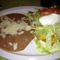 El Ranchito Mexican Restaurant - Chicken chimichanga and refried beans.