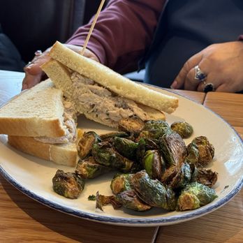 Tupelo Honey Southern Kitchen & Bar - Honey pecan chicken salad sandwich with Brussels sprouts - Southern Near Me - Denver, Colorado Tupelo Honey Southern Kitchen & Bar - Honey pecan chicken salad sandwich with Brussels sprouts - Southern Near Me - Denver, Colorado