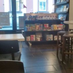Jiný Kafe - A view of the entrance and shelf w items/gifts for sale.