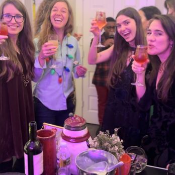 Nay’s Bar - Guest cheering with aperol spritz - Bartenders Near Me Nay’s Bar - Guest cheering with aperol spritz - Bartenders Near Me