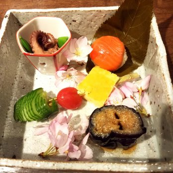 wa’z - Assorted appetizers, braised octopus, salmon sushi, grilled eggplant, Japanese omelette, tomatoes and cucumber - Japanese Near Me - Seattle, Washington