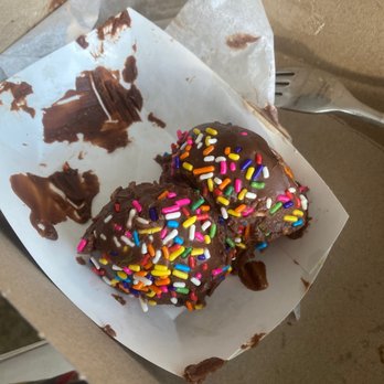 Hi-Five Doughnuts - Doughnut holes with chocolate glaze and sprinkles. Mostly eaten. - Donuts Near Me - Louisville, Kentucky Hi-Five Doughnuts - Doughnut holes with chocolate glaze and sprinkles. Mostly eaten. - Donuts Near Me - Louisville, Kentucky