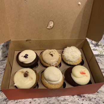 Red Velvet Cupcakery - Front row L-R: Carrot Cake, ?, Red Velvet Cupcake,  Back row: Black Velvet Cupcake, Caramel Latte Cupcake, Coconut Lemon Cupcake. - Bakeries Near Me - Washington, DC, District of Columbia