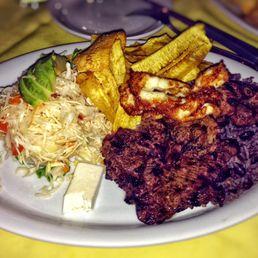Carne asada with sweet plain rain option and fried Nicaraguan cheese as an additional side Carne asada with sweet plain rain option and fried Nicaraguan cheese as an additional side