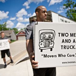 Two Men and a Truck - Movers carrying boxes