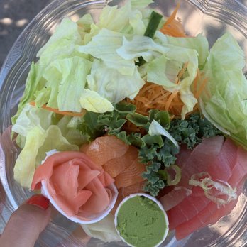 Okane - a person holding a bowl of food - Japanese Near Me - Montreal, Quebec Okane - a person holding a bowl of food - Japanese Near Me - Montreal, Quebec