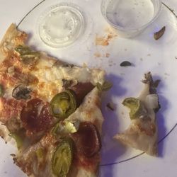 Pizza with NO black olive. With pieces of black olives..