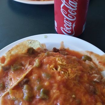 Lucero's - Ladies and Gentlemen, I present to you, The Smothered Combination Plate.  (Bean burrito, bean tostado and beef taco).  #Heaven #IceColdCoke - Mexican Near Me - Denver, Colorado