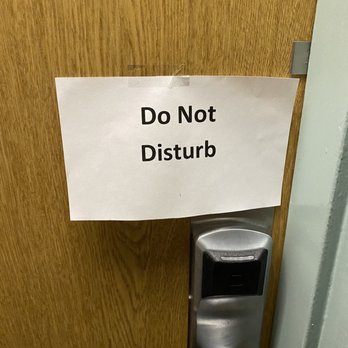 Wyndham Garden - The hotel do not disturb signs.  At least it was printed and with scotch tape ... better than handwritten, I guess. - Hotels Near Me - Austin, Texas