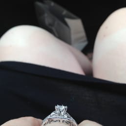 This angle shows the custom-made wedding ring with the swoops and swirls on the side. I love it! This angle shows the custom-made wedding ring with the swoops and swirls on the side. I love it!