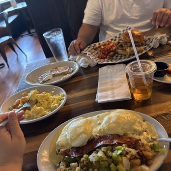 Ellie's Farmhouse - Eggs Benedict with hash,home fries with onions and peppers, spicy egg burger and a pancake with omelette and tater tots - Breakfast & Brunch Near Me - Southington, Connecticut