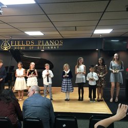 Students holding their trophies at a recent recital!