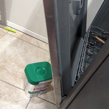 ServiceMaster Absolute Water & Fire Damage Services - Corona - Side of the bent dishwasher. Which is less than a year old. - Damage Restoration Near Me - Corona, California