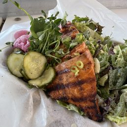 Grilled salmon over greens Grilled salmon over greens