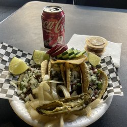 Tacos La Bonita - Taco de asada highly recommended w tostada and grilled jalapeño and onions not. Red salsa and lime . Al pastor taco too .