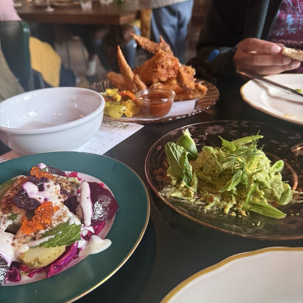 Guacamole w/ smoked yolk and sugar snap peas, chicken wings w/ escabeche, beet salad w/ trout roe Guacamole w/ smoked yolk and sugar snap peas, chicken wings w/ escabeche, beet salad w/ trout roe