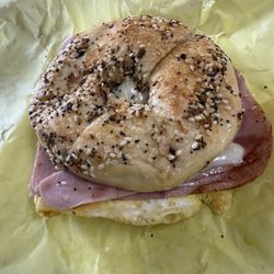 Everything bagel with ham, egg, and cheese