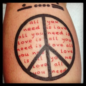 Ink Monkey Tattoo and Piercing - Peace sign with "all you need is love" done by Ramon - Piercing Near Me - Venice, California Ink Monkey Tattoo and Piercing - Peace sign with "all you need is love" done by Ramon - Piercing Near Me - Venice, California