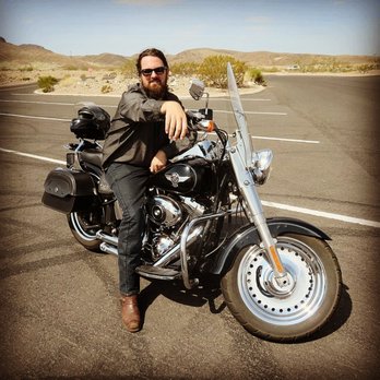 Escape Eagles - Posing on Fat Boy from Escape Eagles. Look how shiny it is... before we hit a rain storm at the Canyon! - Motorcycle Rental Near Me - Las Vegas, Nevada Escape Eagles - Posing on Fat Boy from Escape Eagles. Look how shiny it is... before we hit a rain storm at the Canyon! - Motorcycle Rental Near Me - Las Vegas, Nevada