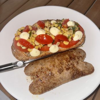 Tonic - open-faced tomato sandwich & side of hot Italian sausage - New American Near Me - Charlottesville, Virginia