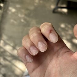 Mill Plaza Nail Salon - Acrylic left of on pointer finger
