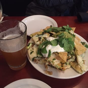 Some Random Bar - Crab nachos w/ a beer for reference to how big the nachos are. - New American Near Me - Seattle, Washington