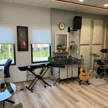 Upbeat Music - a music studio with a guitar, drums, and other musical equipment - Recording & Rehearsal Studios Near Me - Milpitas, California Upbeat Music - a music studio with a guitar, drums, and other musical equipment - Recording & Rehearsal Studios Near Me - Milpitas, California