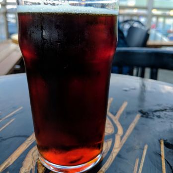 Pub Pit Caribou - a glass of beer on a table - Brewpubs Near Me - Percé, Quebec