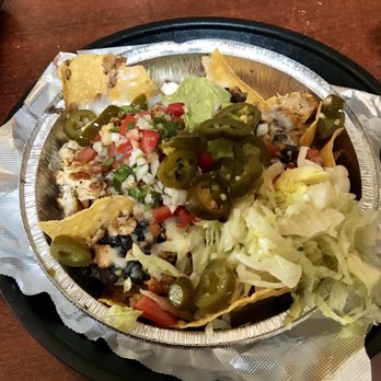 Locos Tacos & Bar - Nachos with grilled chicken, guacamole, black beans, rice. - Tacos Near Me - Tallahassee, Florida
