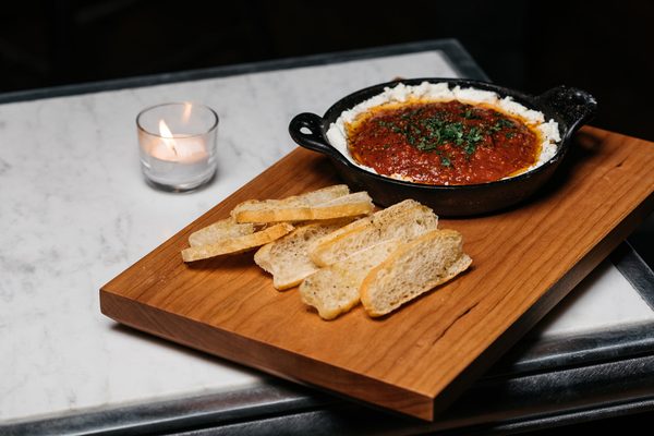 Photo of Brennan's - Saint Louis, MO, US. Brennan's Tomitican Sauce & Goat Cheese. Tomato, Garlic, Onion, Oregano, White Wine with Toasted Bread.