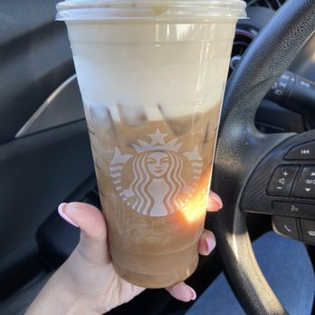 Starbucks - a hand holding a cup of iced coffee - Coffee & Tea Near Me - Somerset, New Jersey Starbucks - a hand holding a cup of iced coffee - Coffee & Tea Near Me - Somerset, New Jersey