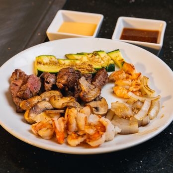 Benihana - Conroe - a plate of meat, vegetables, and sauces - Sushi Bars Near Me - Conroe, Texas Benihana - Conroe - a plate of meat, vegetables, and sauces - Sushi Bars Near Me - Conroe, Texas