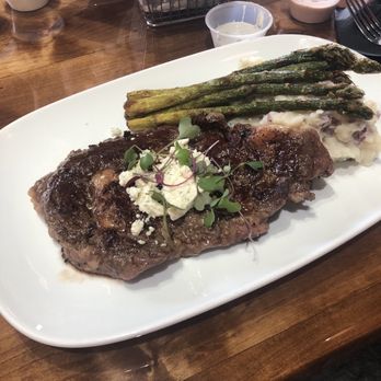 The Hub Eats & Drinks - Ribeye with substituted garlic butter instead of creamy blue - Sports Bars Near Me - Fresno, California The Hub Eats & Drinks - Ribeye with substituted garlic butter instead of creamy blue - Sports Bars Near Me - Fresno, California