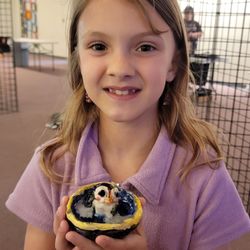 Art Sanctuary - Amelia with her art.