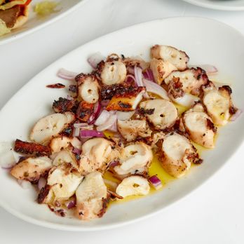 Opa Grille - a plate of food on a table - Greek Near Me - Williston Park, New York
