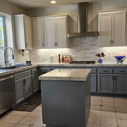 Makeover completed; repainted cabinets, new countertops, backsplash & appliances.