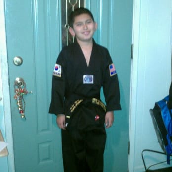 YK Tae Kwon Do Center - Excited to have his monogramed uniform and black belt at last - Taekwondo Near Me - Upland, California
