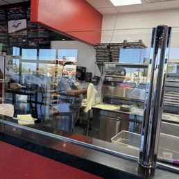 Great team preparing pies, one modern in the oven the team in the back making other delicious creations Great team preparing pies, one modern in the oven the team in the back making other delicious creations