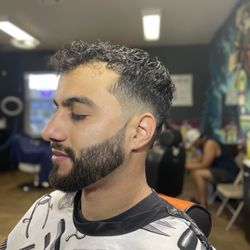 Mid drop fade with beard service.