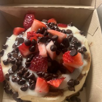 Cinnaholic - I built my own  with Carmel frosting almond frosting chocolate chips and strawberries - Bakeries Near Me - Frisco, Texas