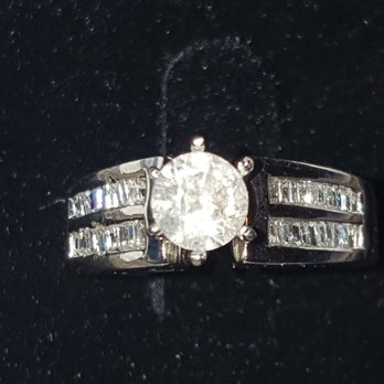 Haddad Jewelers - Before repairs, stone sitting loosely in ring, side diamonds loose and shank has signs of damage - Jewelry Near Me - Houston, Texas Haddad Jewelers - Before repairs, stone sitting loosely in ring, side diamonds loose and shank has signs of damage - Jewelry Near Me - Houston, Texas