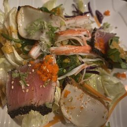 House salad with greens, seaweed salad, fresh tuna and miso dressing.